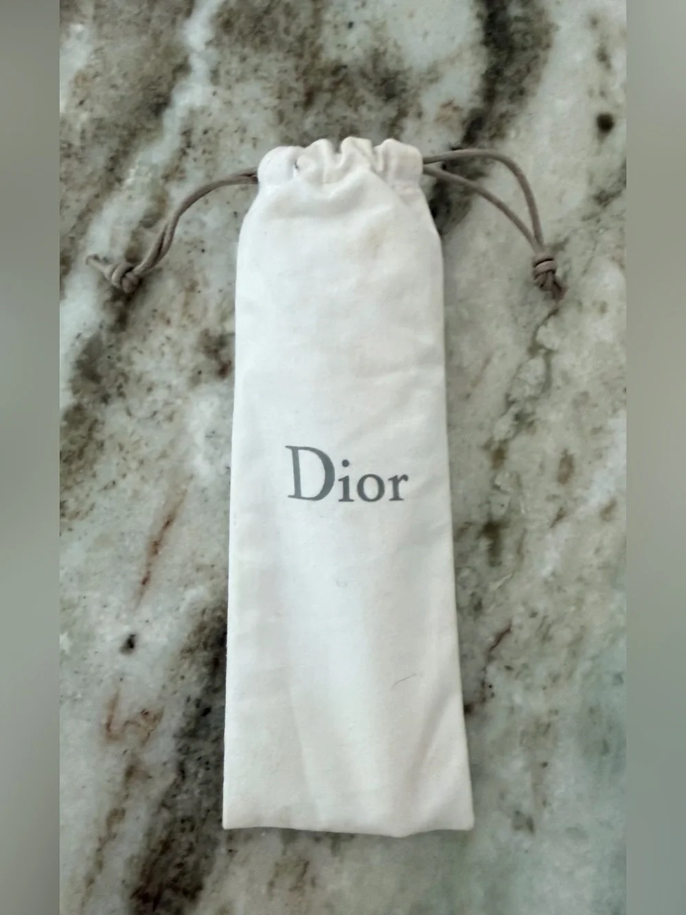 Dior Prestige Le Pétale Multi-Perlé Massage Tool with a branded protective pouch